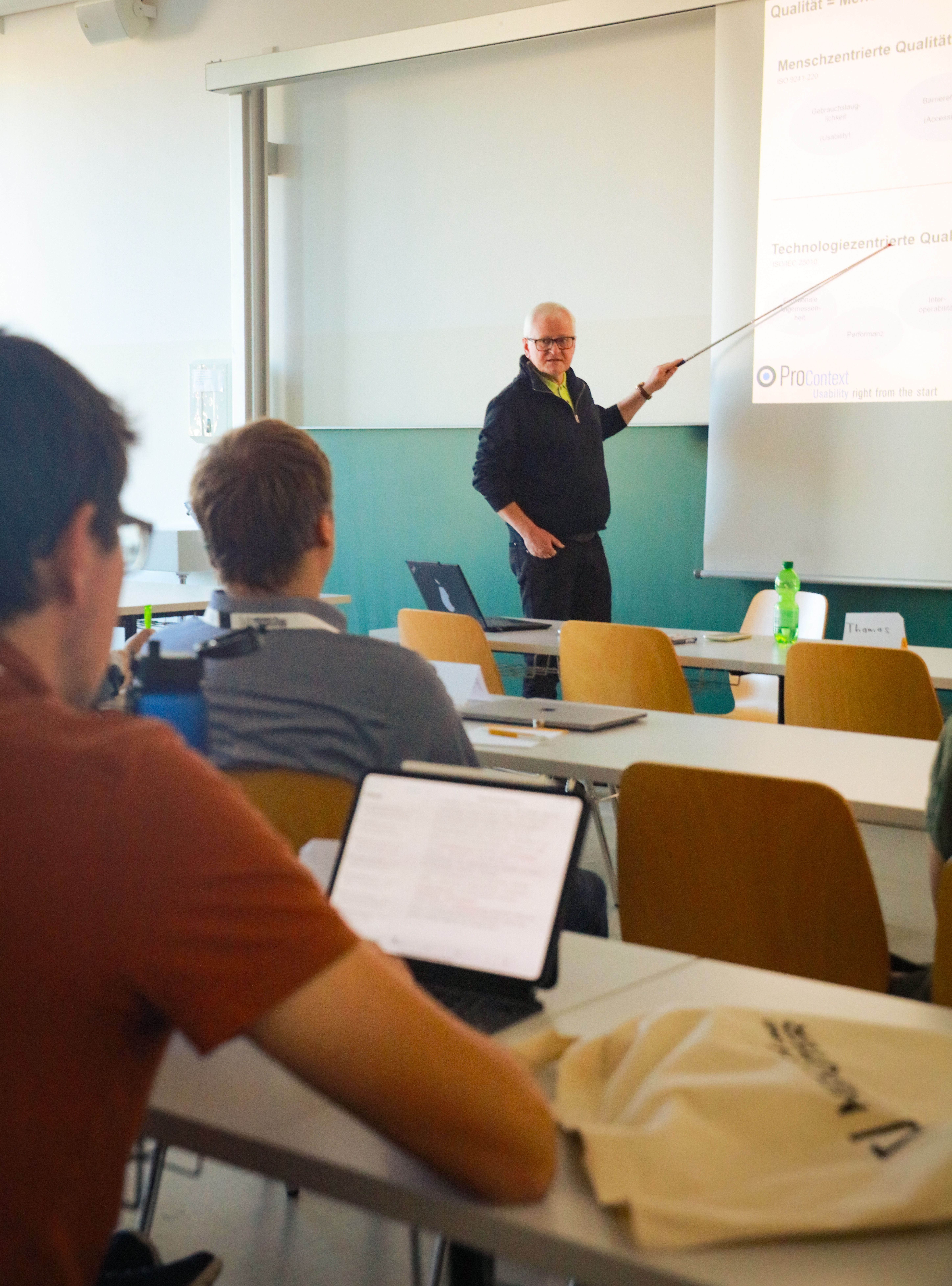 A workshop presentation with the presenter gesticulating.
